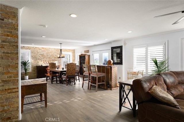 2350 Claudia St, Corona, CA 92882 - living room featuring plenty of natural light, wood finished floors, crown molding, and recessed lighting