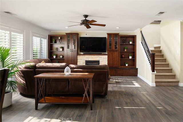 2350 Claudia St, Corona, CA 92882 - living room with a fireplace, stairway, a ceiling fan, dark wood-style flooring, and ornamental molding