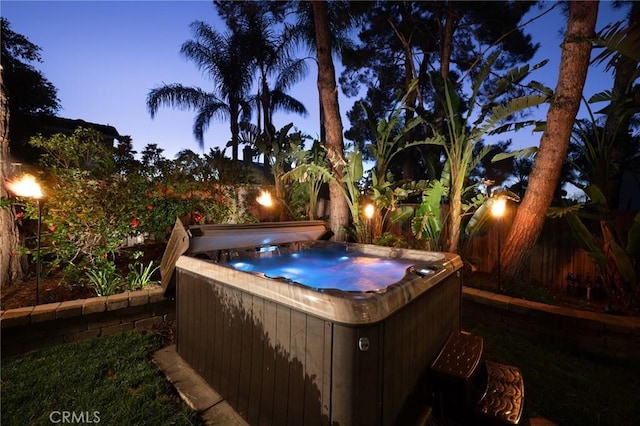 2350 Claudia St, Corona, CA 92882 - yard at dusk featuring a hot tub and a fenced backyard