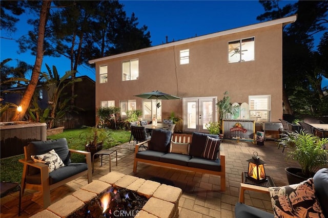 2350 Claudia St, Corona, CA 92882 - patio at night featuring a patio and an outdoor living space with a fire pit