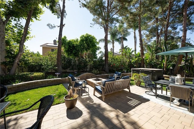 2350 Claudia St, Corona, CA 92882 - fenced backyard with a hot tub, a fire pit, a patio area, and outdoor dining area