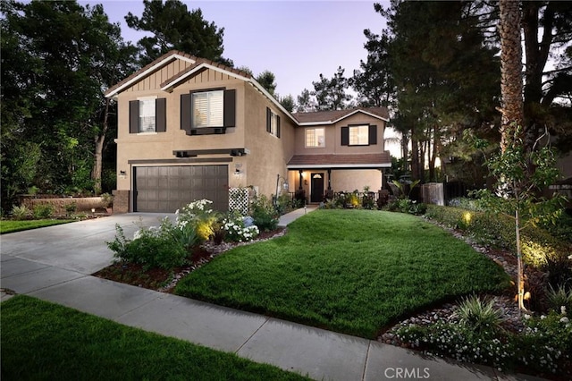 2350 Claudia St, Corona, CA 92882 - view of front of property with a garage, concrete driveway, a yard, and stucco siding