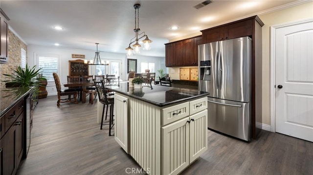 2350 Claudia St, Corona, CA 92882 - kitchen featuring stainless steel refrigerator with ice dispenser, dark wood finished floors, crown molding, dark brown cabinets, and a kitchen breakfast bar
