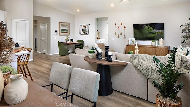 457 Wildrose Cir, San Jacinto, CA 92582 - living area with wood finished floors, recessed lighting, and vaulted ceiling