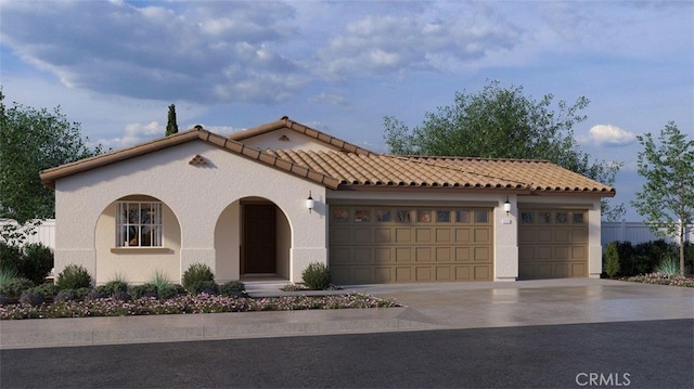 457 Wildrose Cir, San Jacinto, CA 92582 - mediterranean / spanish home featuring a tile roof, concrete driveway, a garage, and stucco siding