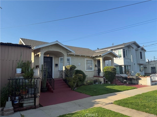 782 W 14th St, San Pedro, CA 90731 - view of front of house featuring stucco siding and a front yard