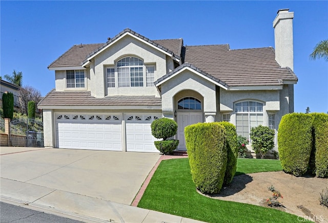 6721 Silver Oak Pl, Riverside, CA 92506 - traditional home featuring an attached garage, a tiled roof, stucco siding, and a chimney