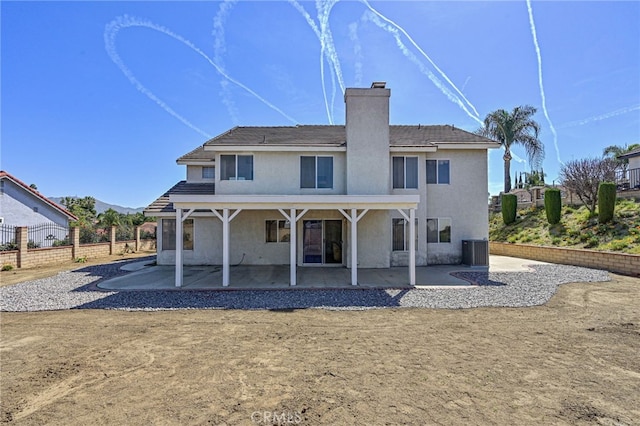 6721 Silver Oak Pl, Riverside, CA 92506 - rear view of property featuring a patio area, a chimney, and stucco siding