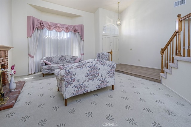 6721 Silver Oak Pl, Riverside, CA 92506 - carpeted living room featuring stairs and a towering ceiling