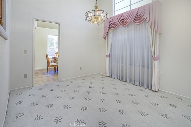 6721 Silver Oak Pl, Riverside, CA 92506 - empty room featuring a chandelier and baseboards