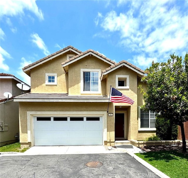 9 Greenwich Ct, Aliso Viejo, CA 92656 - traditional-style house with stucco siding, asphalt driveway, a garage, and a tile roof