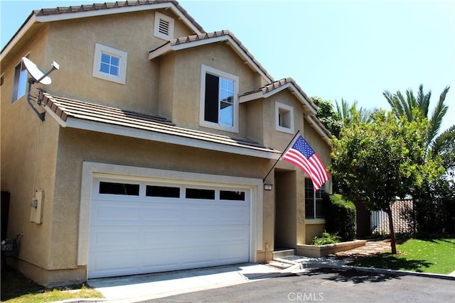 9 Greenwich Ct, Aliso Viejo, CA 92656 - traditional-style home with a garage, stucco siding, and a tile roof