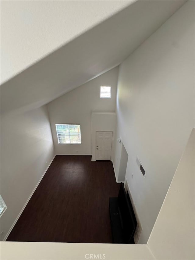9 Greenwich Ct, Aliso Viejo, CA 92656 - unfurnished living room with wood finished floors and high vaulted ceiling
