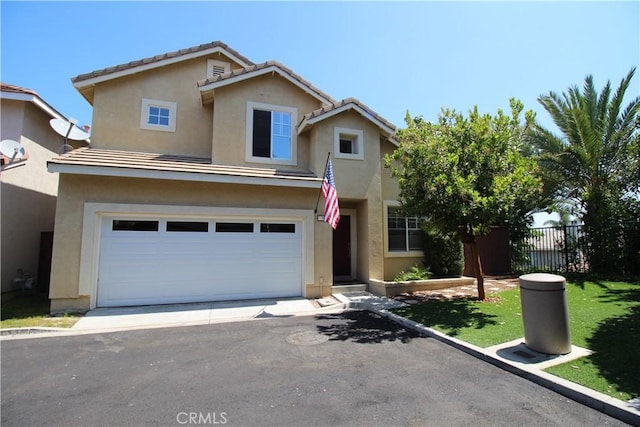 9 Greenwich Ct, Aliso Viejo, CA 92656 - traditional-style house with stucco siding, driveway, and an attached garage