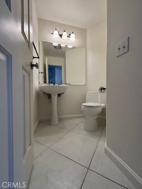 9 Greenwich Ct, Aliso Viejo, CA 92656 - bathroom featuring tile patterned floors and a chandelier