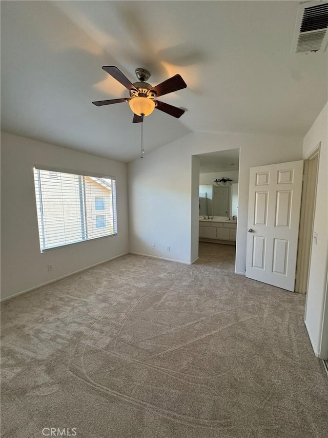 9 Greenwich Ct, Aliso Viejo, CA 92656 - unfurnished bedroom with vaulted ceiling, carpet flooring, connected bathroom, and a ceiling fan