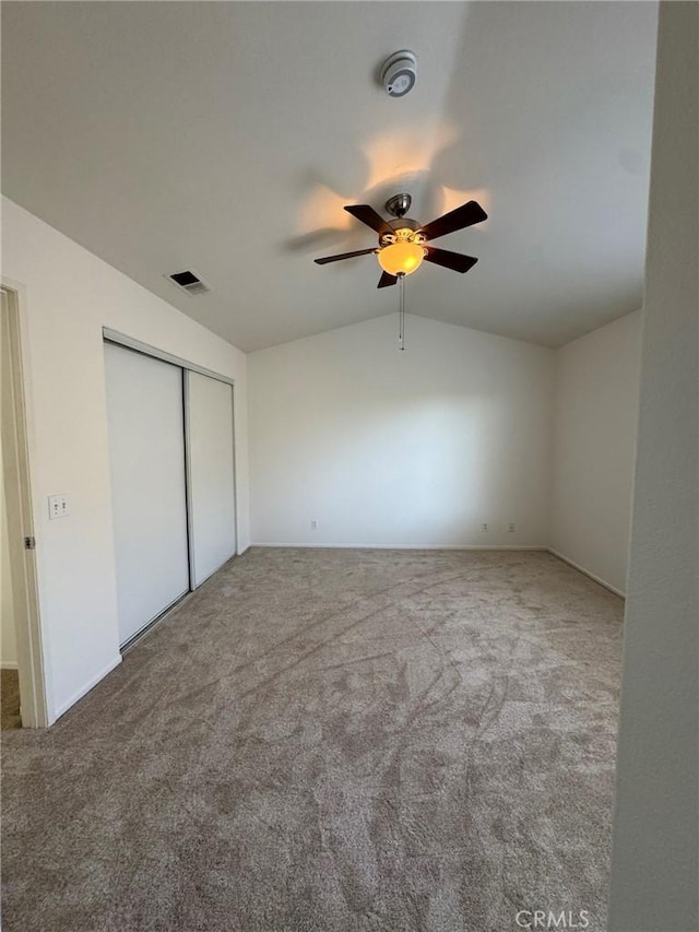 9 Greenwich Ct, Aliso Viejo, CA 92656 - unfurnished bedroom with carpet, vaulted ceiling, a closet, and ceiling fan