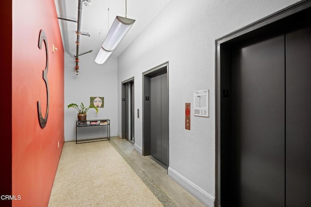 315 E 8th St Unit 301, Los Angeles, CA 90014 - corridor featuring elevator and dark speckled floor