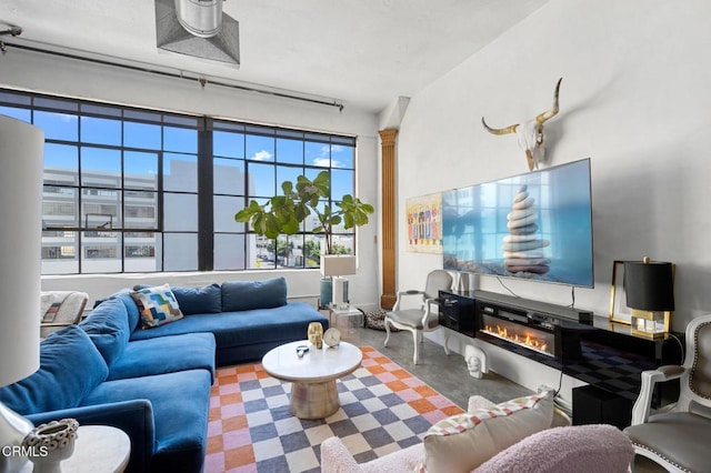 315 E 8th St Unit 301, Los Angeles, CA 90014 - living area with a glass covered fireplace and concrete flooring