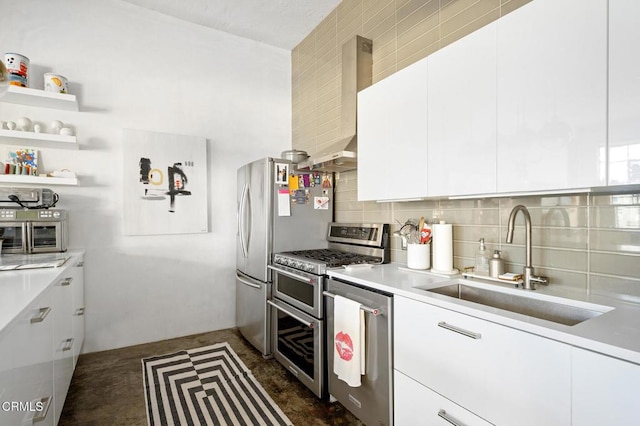 315 E 8th St Unit 301, Los Angeles, CA 90014 - kitchen with appliances with stainless steel finishes, white cabinets, light countertops, backsplash, and modern cabinets