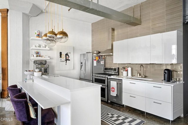 315 E 8th St Unit 301, Los Angeles, CA 90014 - kitchen featuring appliances with stainless steel finishes, wall chimney exhaust hood, open shelves, decorative backsplash, and light countertops