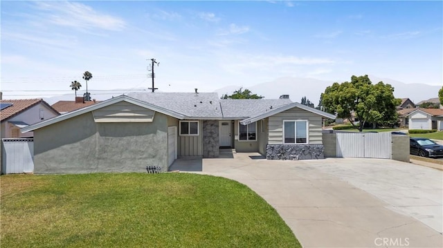 1322 W 6th St, Ontario, CA 91762 - ranch-style house featuring a gate, driveway, a mountain view, and stone siding