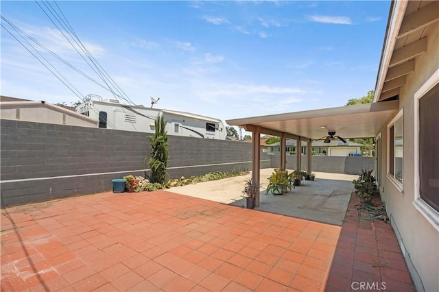 1322 W 6th St, Ontario, CA 91762 - fenced backyard featuring a ceiling fan and a patio area