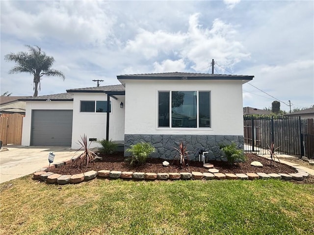 14714 S Denver Ave, Gardena, CA 90248 - view of front of home featuring an attached garage, stucco siding, and driveway