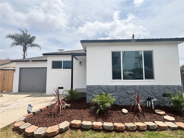 14714 S Denver Ave, Gardena, CA 90248 - view of front of home featuring a garage, stucco siding, and concrete driveway
