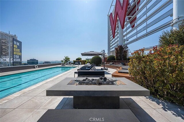 6250 Hollywood Blvd Unit 4D, Los Angeles, CA 90028 - community pool featuring a patio area and an outdoor fire pit