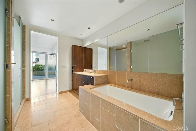 6250 Hollywood Blvd Unit 4D, Los Angeles, CA 90028 - full bath with vanity, a garden tub, tile patterned flooring, and recessed lighting