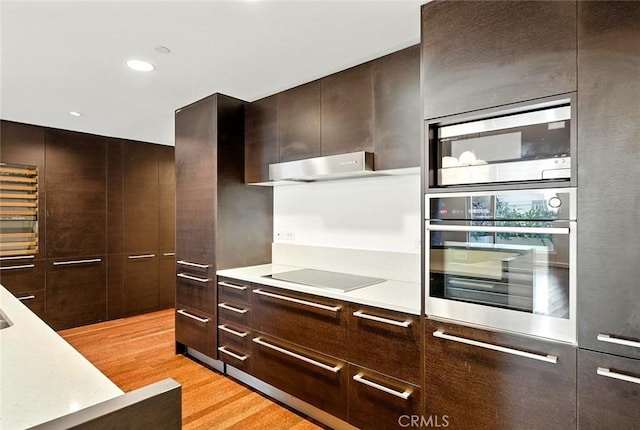 6250 Hollywood Blvd Unit 4D, Los Angeles, CA 90028 - kitchen with appliances with stainless steel finishes, modern cabinets, light wood-style flooring, light countertops, and recessed lighting