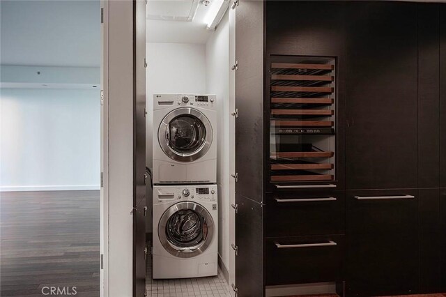 6250 Hollywood Blvd Unit 4D, Los Angeles, CA 90028 - washroom with stacked washing machine and dryer and wood finished floors