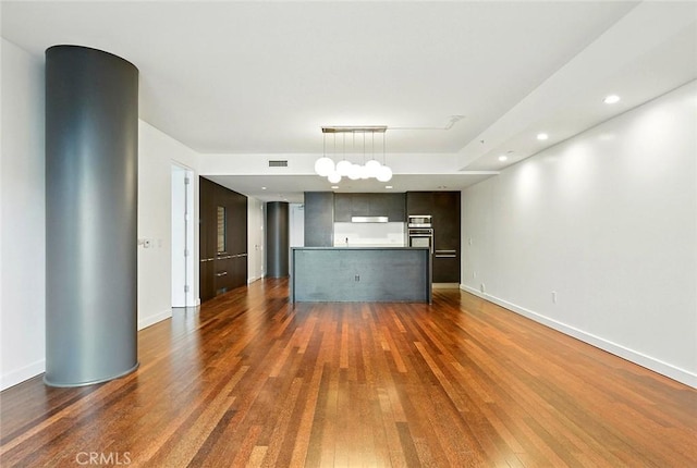 6250 Hollywood Blvd Unit 4D, Los Angeles, CA 90028 - unfurnished living room featuring dark wood-type flooring and recessed lighting
