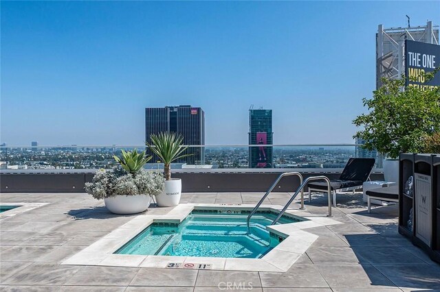 6250 Hollywood Blvd Unit 4D, Los Angeles, CA 90028 - view of pool with a hot tub, a view of city, a pool, and a patio area