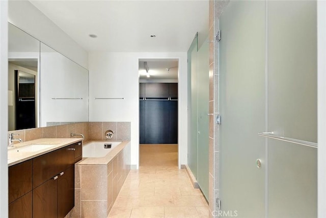6250 Hollywood Blvd Unit 4D, Los Angeles, CA 90028 - full bath with vanity, a stall shower, a bath, and a spacious closet