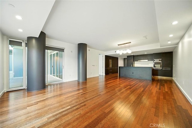 6250 Hollywood Blvd Unit 4D, Los Angeles, CA 90028 - unfurnished living room featuring hardwood / wood-style flooring and recessed lighting