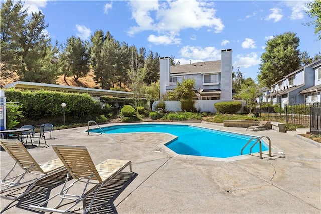 12301 Osborne St Unit 67, Pacoima, CA 91331 - community pool featuring a patio and a residential view