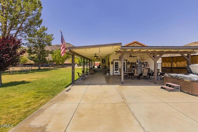 30370 Bouquet Canyon Rd, Santa Clarita, CA 91390 - rear view of house featuring a ceiling fan, a patio area, and a hot tub
