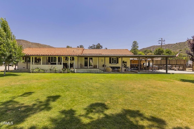30370 Bouquet Canyon Rd, Santa Clarita, CA 91390 - rear view of house featuring a tile roof, a patio area, and a mountain view