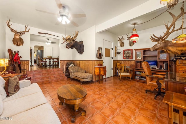 30370 Bouquet Canyon Rd, Santa Clarita, CA 91390 - living room with a wainscoted wall, ceiling fan, a desk, wooden walls, and tile patterned flooring