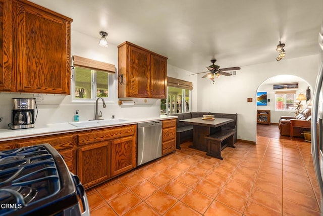 30370 Bouquet Canyon Rd, Santa Clarita, CA 91390 - kitchen with stainless steel dishwasher, stove, plenty of natural light, and arched walkways