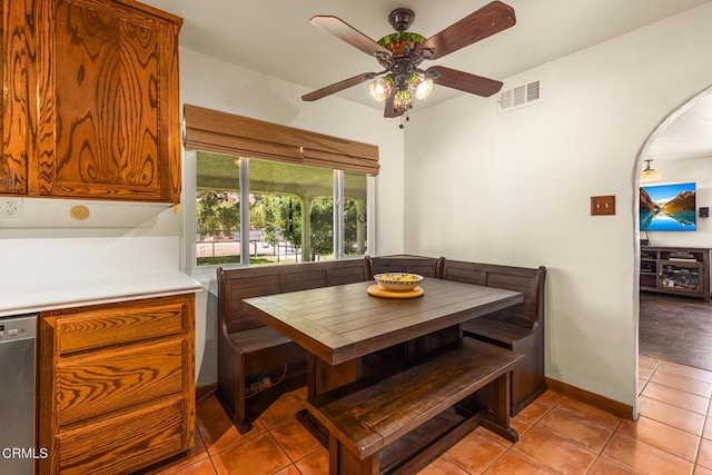 30370 Bouquet Canyon Rd, Santa Clarita, CA 91390 - dining area with ceiling fan, light tile patterned floors, and arched walkways