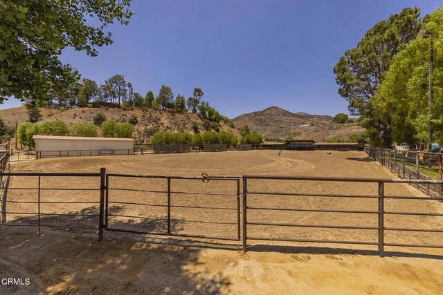 30370 Bouquet Canyon Rd, Santa Clarita, CA 91390 - view of yard featuring an enclosed horse arena, a mountain view, and a rural view
