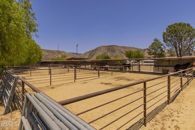 30370 Bouquet Canyon Rd, Santa Clarita, CA 91390 - view of yard featuring an exterior structure, a view of countryside, a mountain view, and an outbuilding