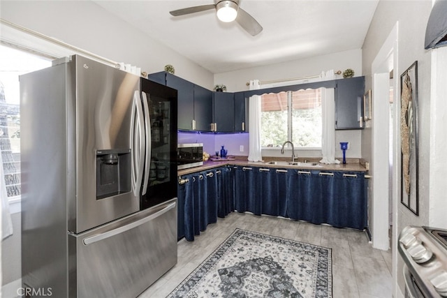 1010 N Madison Ave, Pasadena, CA 91104 - kitchen featuring appliances with stainless steel finishes, blue cabinetry, and a ceiling fan