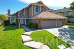 2430 Spring Meadow Dr, Chino Hills, CA 91709 - view of front facade with driveway and a front yard