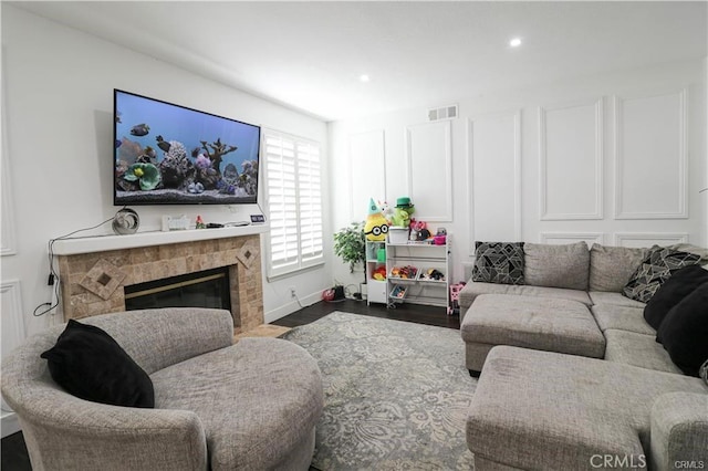 2430 Spring Meadow Dr, Chino Hills, CA 91709 - living area featuring wood finished floors, recessed lighting, and a fireplace with flush hearth