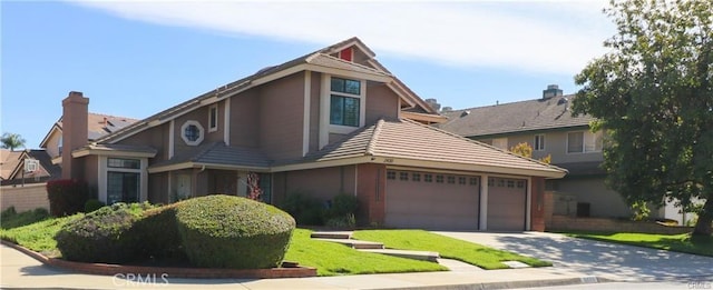 2430 Spring Meadow Dr, Chino Hills, CA 91709 - view of front of home with concrete driveway and a garage