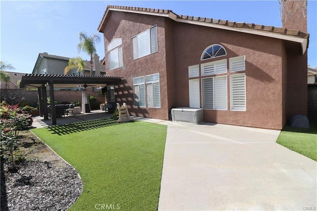 2430 Spring Meadow Dr, Chino Hills, CA 91709 - back of property with a pergola, a patio area, a fenced backyard, and stucco siding